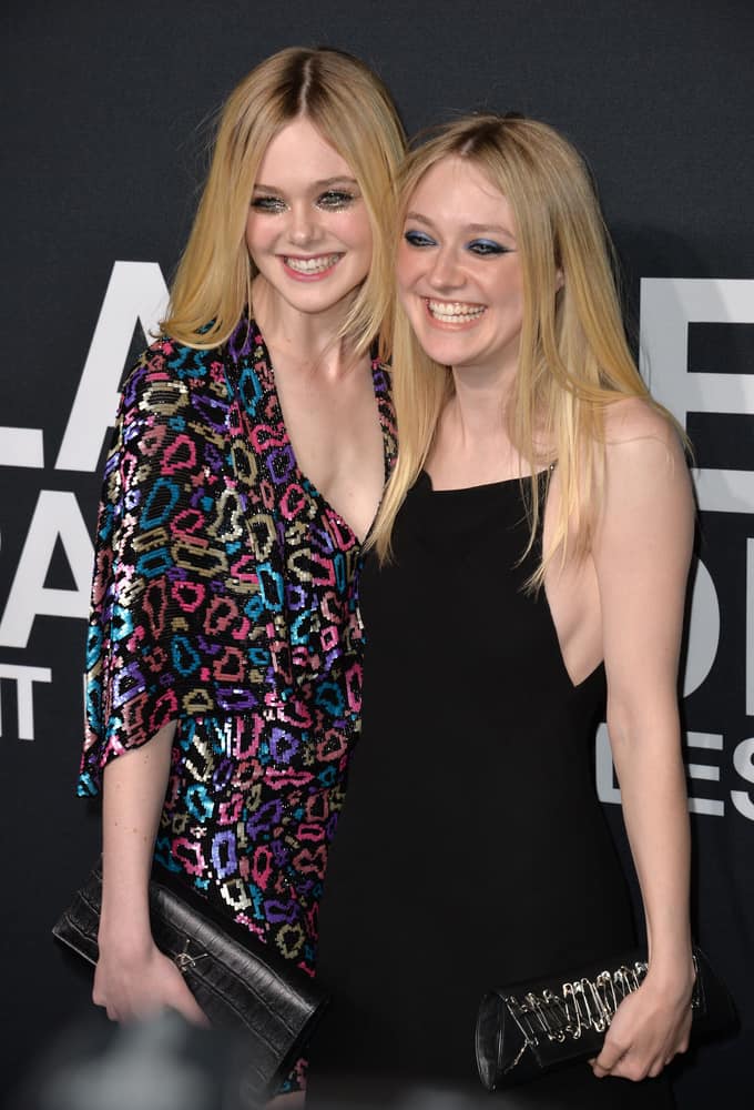 On February 10, 2016, actresses Elle Fanning and Dakota Fanning attended the Saint Laurent at the Palladium fashion show at the Hollywood Palladium.