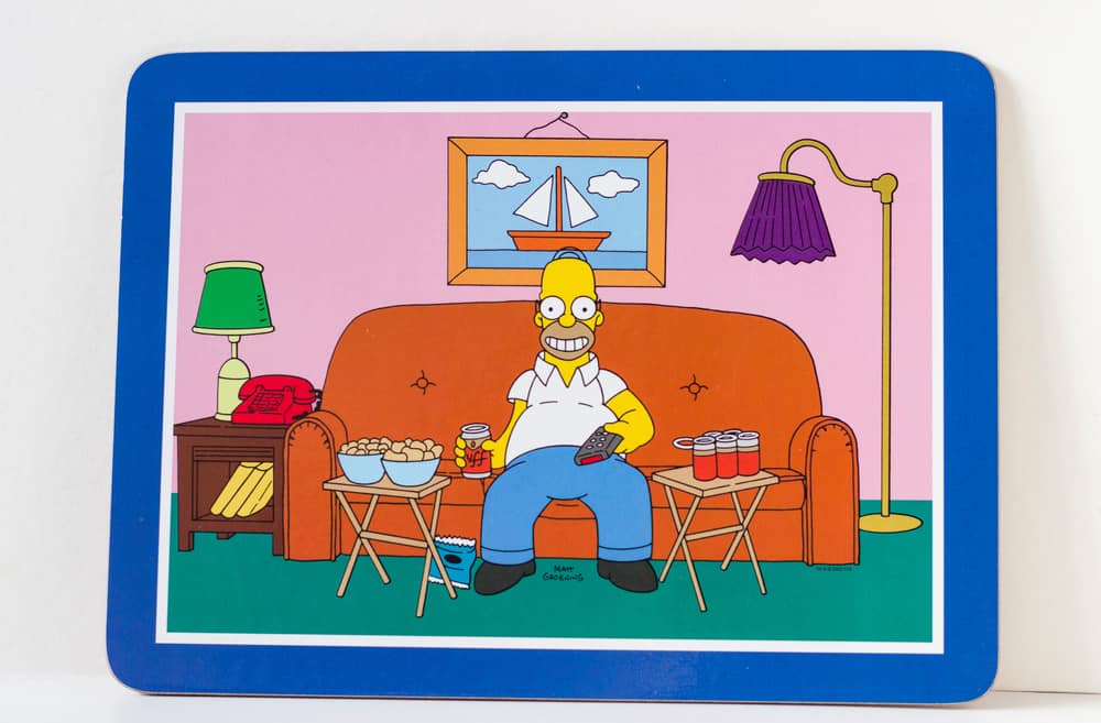 This is a coaster with a picture of The Simpsons' Homer Simpson on the sofa.