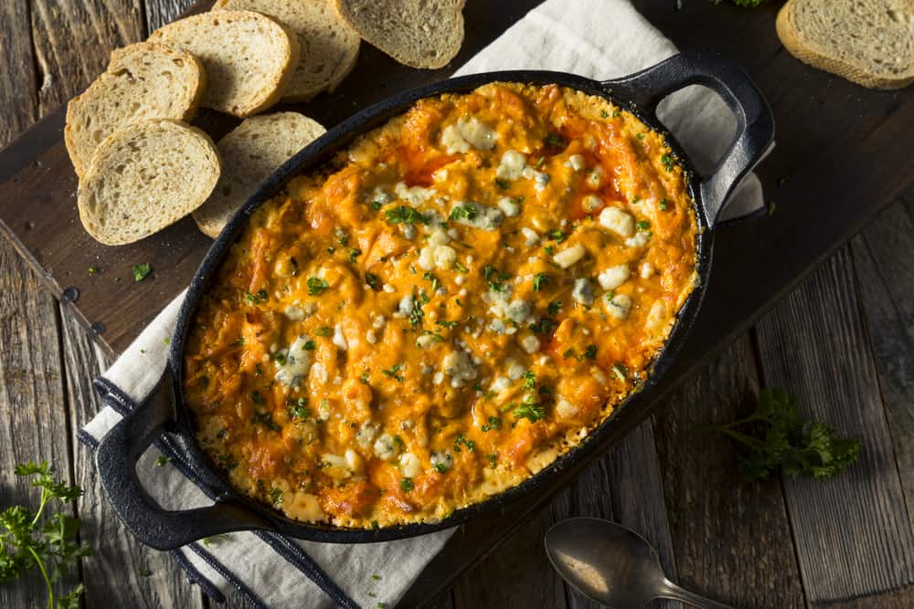 Buffalo chicken dip with cheese and crostini