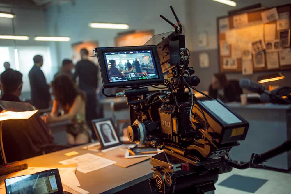 This is a close look at a 4K camera filming a scene in a police station.