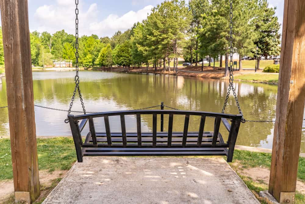 This is a hanging bench facing the pond in a park in South Carolina.