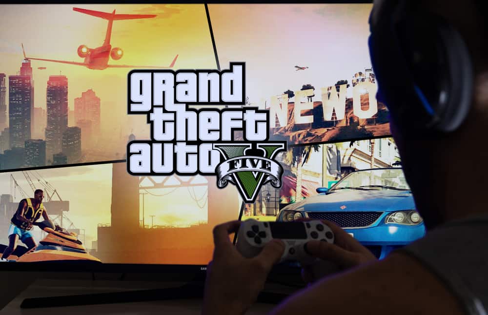 A man playing Grand Theft Auto V on his gaming console.